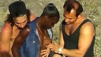 Two White Guys Pleasure A Black Woman At The Beach In A Threesome